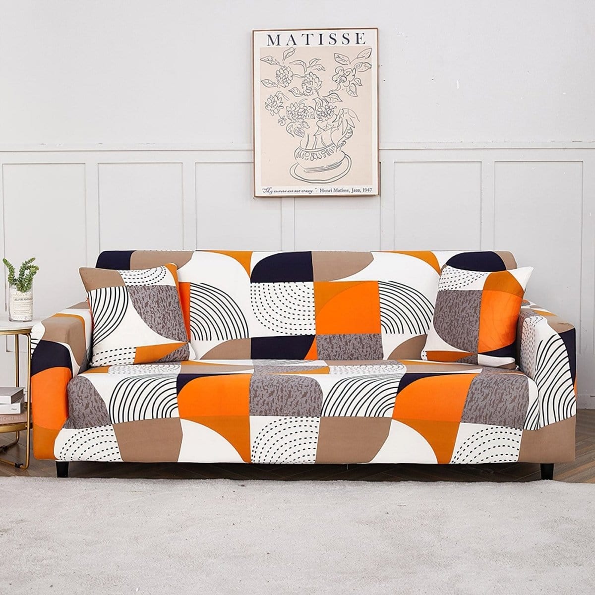 Stretch-Sofabezug Patchwork Orange und Schwarz